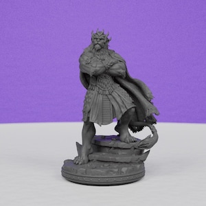 May include: A gray figurine of a regal figure with crossed arms, a long beard, and a crown. The figure wears a cape and a skirt-like garment, standing on a rocky base. The base is round with a decorative border.