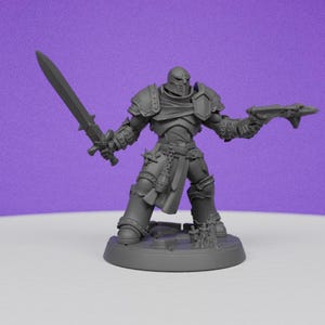 May include: A grey plastic miniature of a knight in armour holding a sword and a pistol. The knight is standing on a round base.
