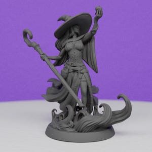 May include: A grey figurine of a witch holding an apple and a staff. The witch wears a wide-brimmed hat, corset, and flowing robes. The base features stylized waves. The figurine is set against a purple background.