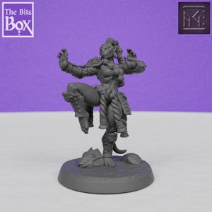 May include: A grey figurine of a female warrior in a dynamic pose, with one leg raised and arms outstretched. The figure is detailed with armour and rope accents. The base includes a helmet and rock. The Bits Box logo is in the upper left.