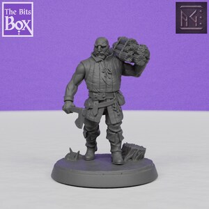 May include: A gray miniature figure of a bearded man carrying a bundle over his shoulder and an axe. The figure is wearing a vest, pants, and boots. The base has the text "The Bits Box".