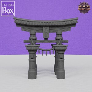 May include: A grey miniature Torii gate, a traditional Japanese Shinto shrine gate, with intricate details. The gate features a curved top, vertical pillars, and horizontal beams, with text on the centre panel. The background is a solid purple.