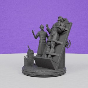 May include: A gray, 3D-printed figurine depicting a torture scene. It features a figure strapped to a wooden rack, with another figure in a lab coat standing nearby. A machine and a wheel are also visible.