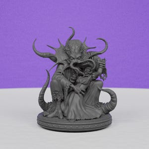 May include: A gray sculpture depicting a monstrous figure with tentacles and horns embracing a person in a flowing gown. The sculpture is on a round base with a purple background.