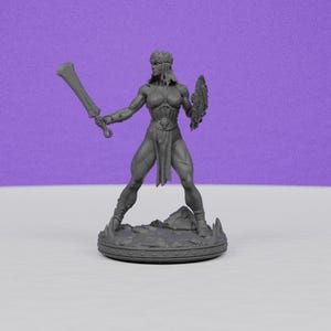 May include: A gray figurine of a warrior woman, holding a large sword in her right hand and a shield in her left. She wears a crown, armor, and a skirt. The figurine stands on a rocky base with a circular border. The background is a solid purple.