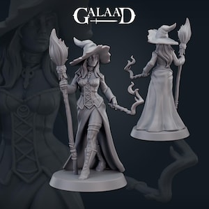 May include: A grey painted miniature figurine of a witch holding a staff with a flame at the top. The witch is wearing a long dress, a hat, and boots. The figurine is standing on a round base.