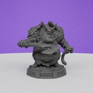 May include: A gray, detailed miniature figurine of a fantasy warrior holding a large axe and a rope-like weapon. The figure has armor, horns, and a textured appearance, standing on a decorative base.