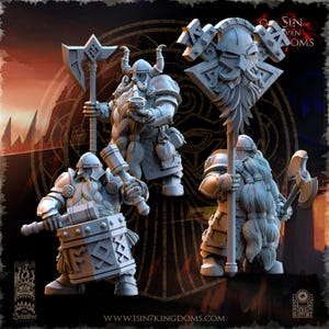 May include: Three grey plastic miniature figures of dwarves, each holding a different weapon. The dwarf on the left is holding a hammer, the dwarf in the centre is holding a flag with a bearded face on it, and the dwarf on the right is holding an axe. The figures are standing on a dark background.