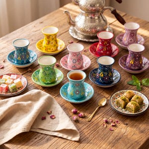 Turkish tea cups with saucers on a wooden tea table with baklava, Turkish delight, mint, and teapot, handmade ceramic tea set for tea lover gift.