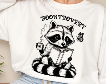 Booktrovert PNG, Funny Book Lover PNG, Reading Raccoon png, Trendy Bookish png, Book Lover Gift PNG Sublimation, reading book png svg lover
