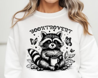 Booktrovert PNG, Funny Book Lover PNG, Reading Raccoon png, Trendy Bookish png, Book Lover Gift PNG Sublimation, reading book png svg lover