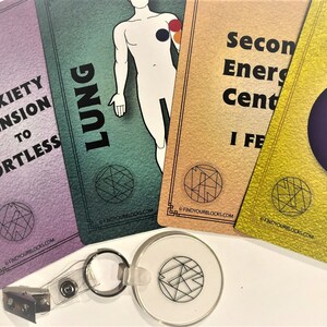 May include: Four cards with different colors and designs. The cards have text that reads "Anxiety Tension to Effortless", "Lung", "Second Energy Center I Feel", and a black circle. The cards have a black and white design in the bottom corner.