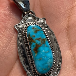Native made turquoise pendant