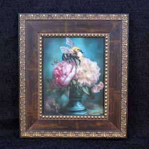May include: A framed painting of a bee pollinating a bouquet of pink and white flowers in a blue vase. The background is a teal blue.