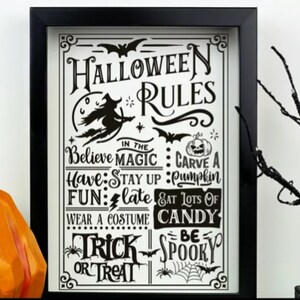 May include: Black and white Halloween rules sign in a black frame. The sign says "Halloween Rules" and lists rules like "Believe in the Magic", "Carve a Pumpkin", "Stay Up Late", "Eat Lots of Candy", "Wear a Costume", "Trick or Treat", and "Be Spooky".