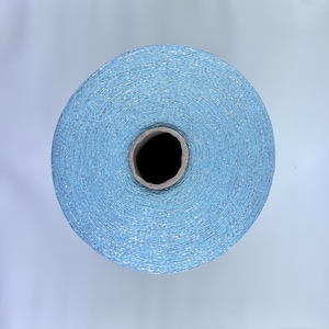 May include: A spool of light blue thread with a subtle shimmer.