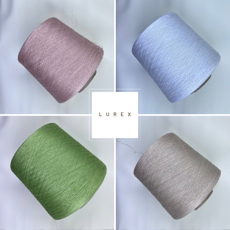 May include: Four spools of thread in different colors: pink, light blue, green, and beige. The thread is a shiny, metallic type called Lurex.