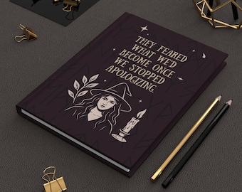 May include: A dark purple journal with the quote "THEY FEARED WHAT WE'D BECOME ONCE WE STOPPED APOLOGIZING." A witch illustration and a candle are also featured. Gold and black pencils and gold binder clips are also visible.
