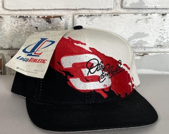 May include: White and black baseball cap with a red and white number 3 and a signature that says "Dale Earnhardt Jr." The cap is made by Logo Athletic.