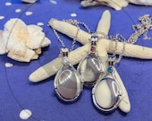 Collana A 2 Fili Di Perle Bianche Con Ciuffo Lungo E Argento Rodiat Collana A 2 Fili Di Perle Bianche Con Ciuffo Lungo E Argent