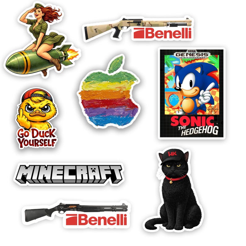 May include: A collection of colorful stickers featuring various designs. Includes a cartoon of a woman riding a missile, a rainbow-colored apple, a duck with the text "Go Duck Yourself", a Sonic the Hedgehog game cover, and a black cat.