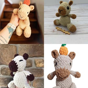 May include: A collection of four crochet plush toys featuring various animal designs. The plushies are crafted from textured yarn in shades of beige, brown, white, and green, with some figures topped with small orange pumpkin-shaped accents.