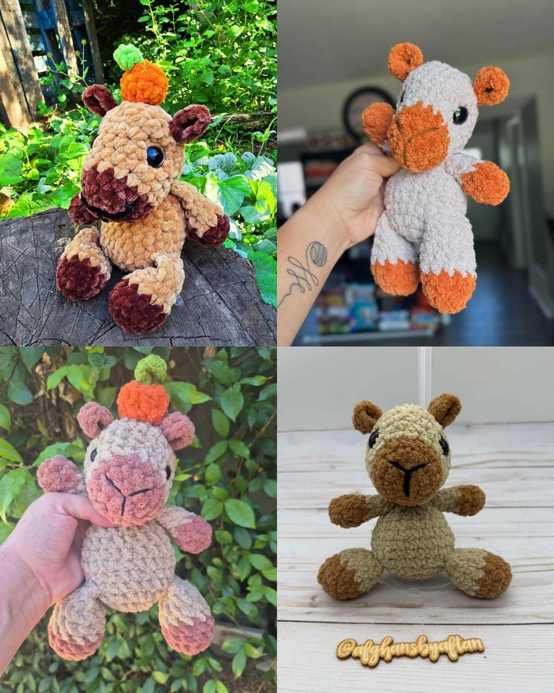 May include: A collection of four handmade crochet plush toys shaped like camels. Each camel features a soft, textured yarn body in shades of tan, brown, or white, with dark plastic eyes and a small orange or green crocheted pumpkin on its head.