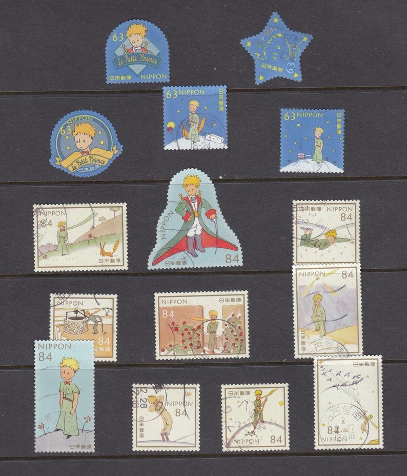 May include: A selection of vintage Japanese postage stamps depicting scenes from "Le Petit Prince." The stamps display the character in different settings, with bright colours and the text "NIPPON" and values such as "63" and "84".