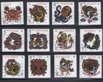 12 sellos de correos usados de Francia 2014 (sin papel).