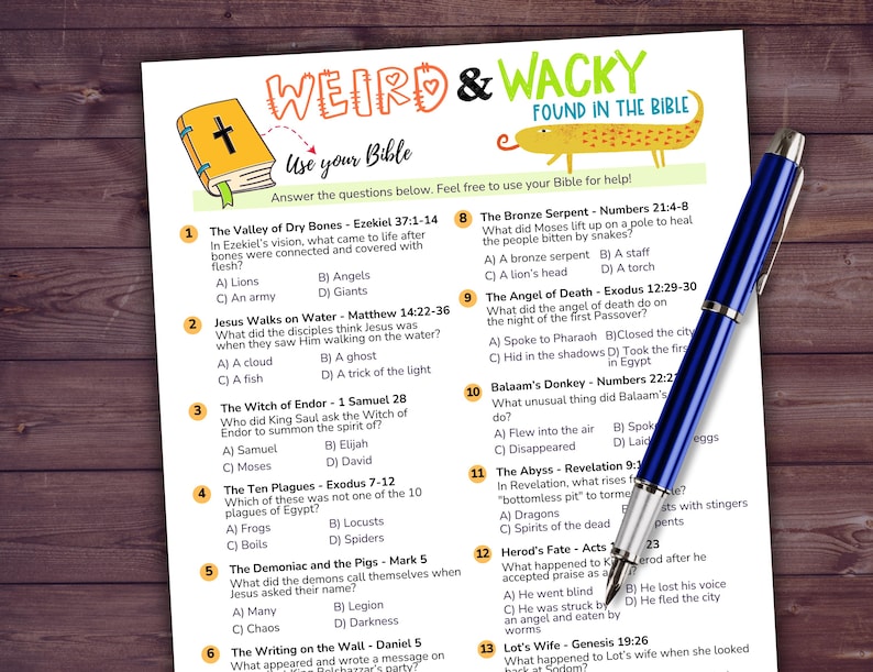 May include: A printed worksheet titled "Weird & Wacky Found in the Bible" with multiple-choice questions. A blue pen rests on the worksheet. The worksheet has a cartoon image of a book and a snake.