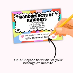 May include: A colorful card with the text "RANDOM ACTS OF KINDNESS" and a message about a lost worm. The card has a blank space to write in a message or website. The text "post your found worm on facebook: The Christmas Cats" is also on the card.