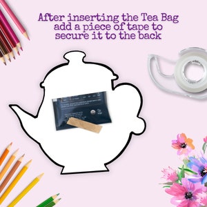May include: A white teapot outline with a tea bag inside. A roll of clear tape is on the right side of the image. The text "After inserting the Tea Bag add a piece of tape to secure it to the back" is at the top of the image.
