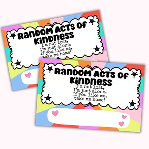 May include: Two colorful cards with a rainbow design and the text "Random Acts of Kindness" and "I'm not lost, I'm just alone. If you like me, take me home!"