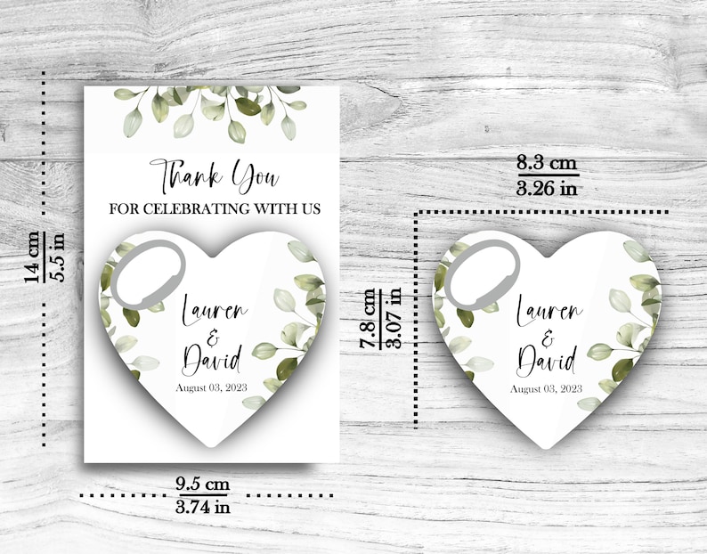 May include: A white heart-shaped bottle opener with a green leafy design and the text "Lauren & David" and "August 03, 2023". The bottle opener is 3.07 inches tall and 3.26 inches wide.