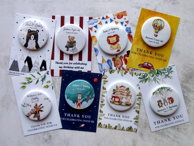 May include: A set of 10 personalized thank you cards with round buttons featuring various animal illustrations. The cards are decorated with different themes, including mountains, stripes, jungle animals, hot air balloons, and rockets. Each card includes a personalized message thanking guests for celebrating with the birthday child.