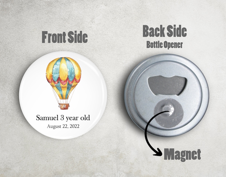 May include: A round magnet with a hot air balloon design. The front side features a yellow and blue hot air balloon with red accents. The text "Samuel 3 year old August 22, 2022" is printed below the balloon. The back side is a bottle opener.