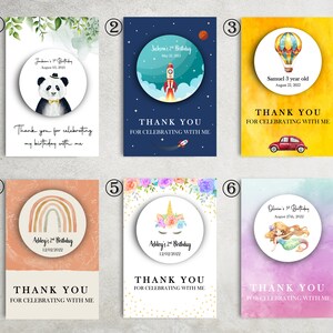 May include: Six colorful thank you cards with different illustrations and text. The cards feature a panda, a rocket ship, a hot air balloon, a rainbow, a unicorn, and a mermaid. Each card has the text "Thank you for celebrating with me".
