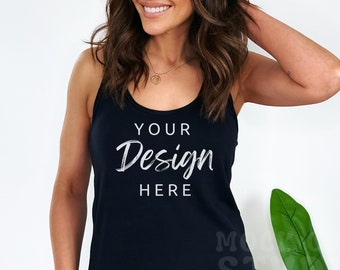 May include: A black tank top with a white graphic that says "YOUR Design HERE".