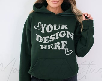 May include: A dark green hooded sweatshirt with the text "YOUR DESIGN HERE" in white with a distressed look and two small hearts on either side of the text.