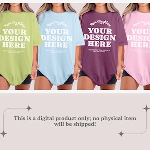 May include: Four oversized t-shirts in different colors: light green, light blue, burgundy, and light pink. Each shirt has the text "Mock City Studio" and "Your Design Here" printed on the front.