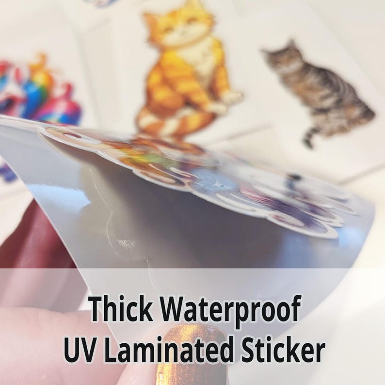 May include: Close-up of a thick, waterproof sticker with a UV laminated finish. The sticker features a colorful design and is partially peeled back to show the glossy finish.