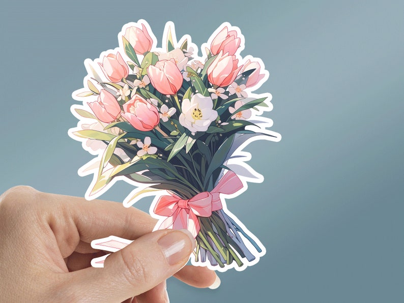 May include: A bouquet of pink and white flowers tied with a pink ribbon. The bouquet is made up of tulips and other white flowers.