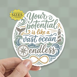 May include: A round sticker with the text "Your potential is like a vast ocean endless." The design includes a compass, lighthouse, and whale tail in shades of blue, green, and brown. The sticker is held by a hand.