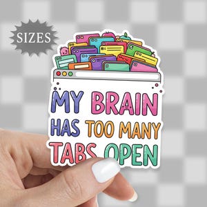May include: A colorful sticker with the text "MY BRAIN HAS TOO MANY TABS OPEN" in a playful font. The design features a computer screen overflowing with various colorful tabs, suggesting a busy mind. The sticker is held by a hand.