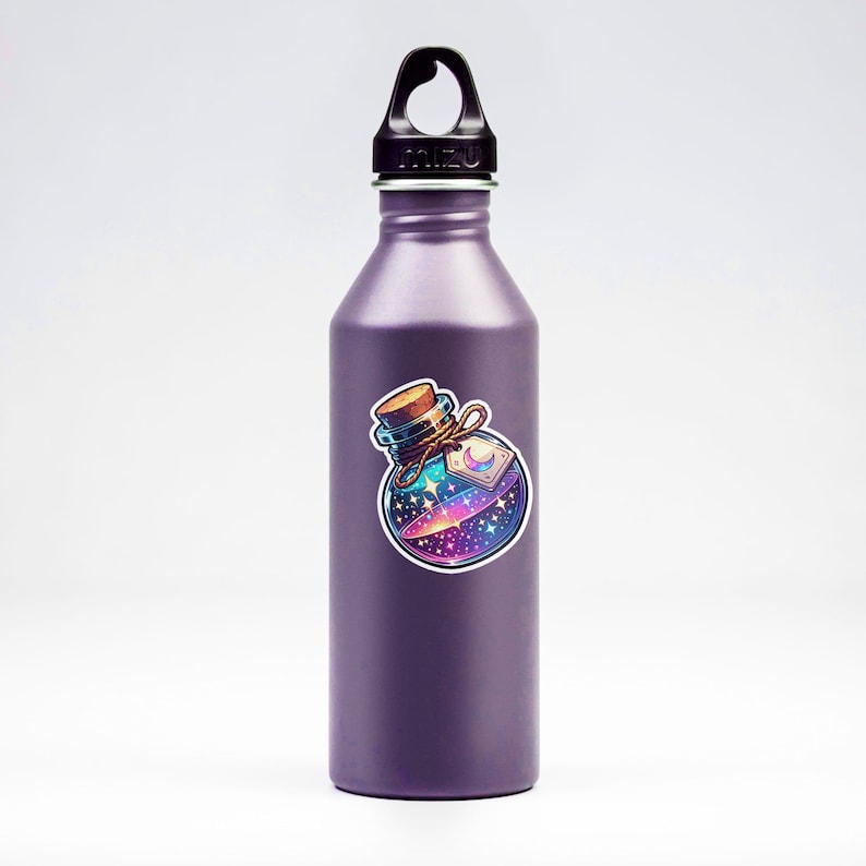 May include: A purple reusable water bottle with a sticker of a glass bottle filled with a swirling galaxy. The bottle has a black lid with a carrying loop.