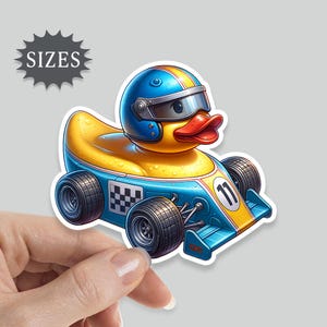 May include: A yellow rubber ducky wearing a blue racing helmet and driving a blue race car with the number 11 on the side.