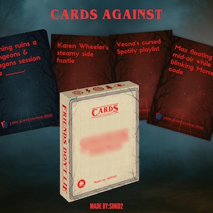 May include: A card game box and cards with text. The box reads "CARDS" and "FRIENDS DON'T LIE". The cards have phrases like "Nothing ruins a Dungeons & Dragons session like..." and "Max floating mid-air while blinking Morse code."