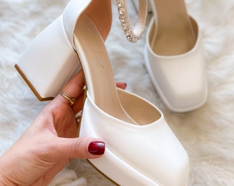 white platform pumps