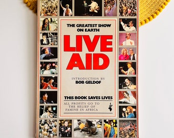 Live Aid 1985 Concert Souvenir Book by Introduced by Bob Geldof, Queen Band Freddie Mercury Madonna Paul McCartney David Bowie U2 Elton John