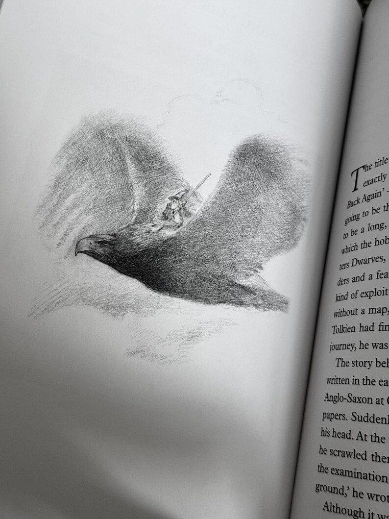 May include: A pencil sketch illustration of a large eagle in flight, carrying a small figure. The eagle's wings are spread wide, and the drawing is detailed with shading. The image is from a book, with text visible on the right side.
